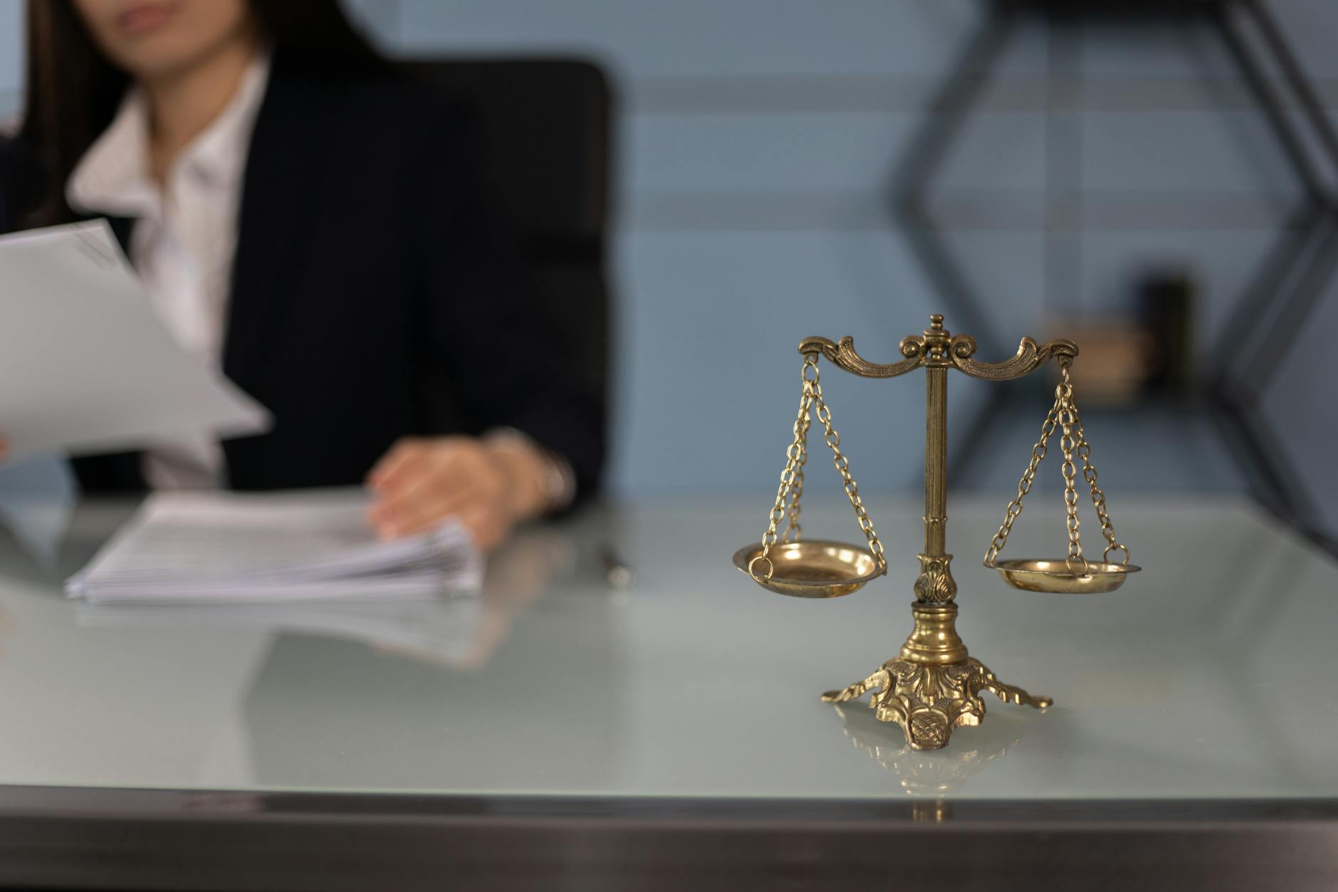 a balance scale on a woman s table